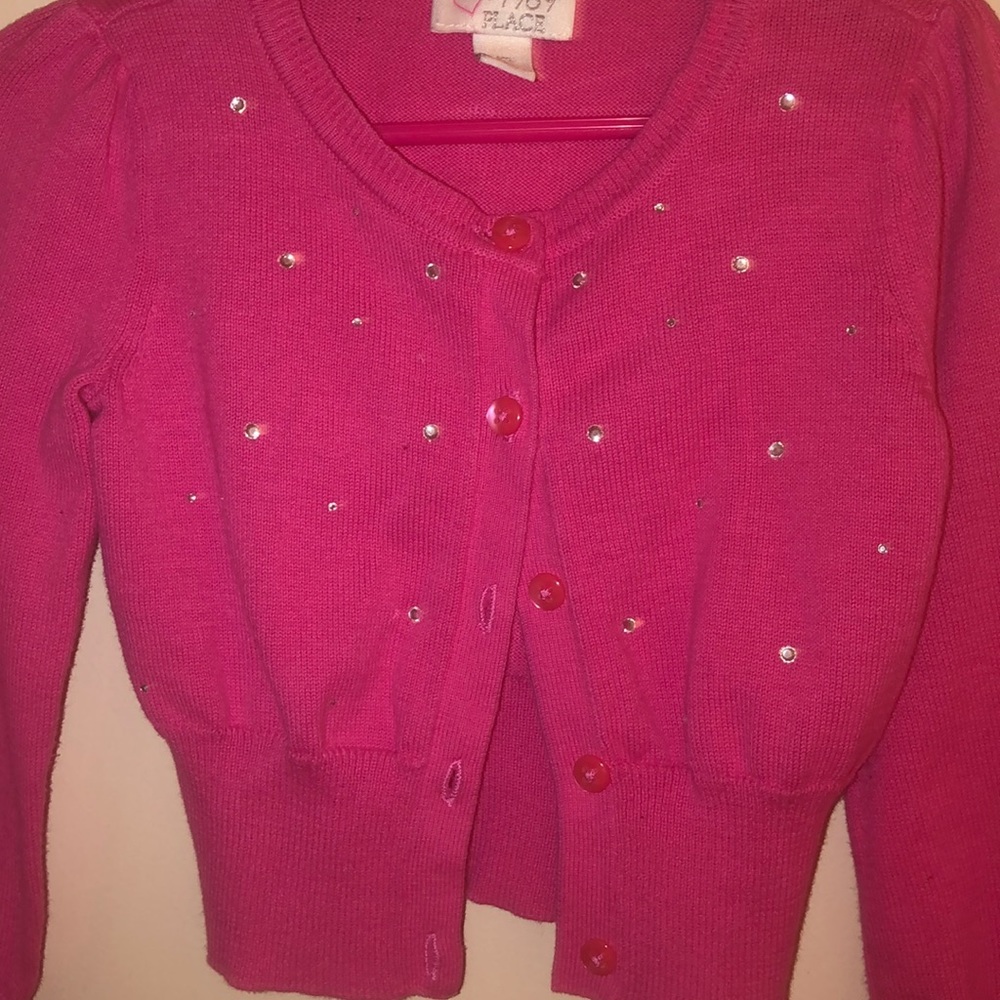 pink baby sweater.